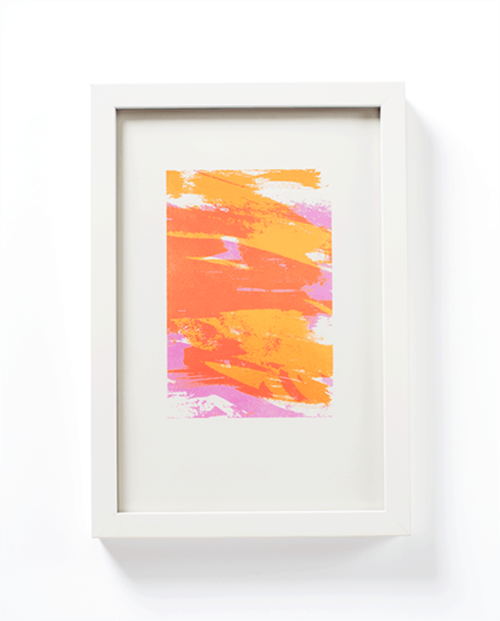 Pink + yellow paint stroke painting by Mayday Press. White frame.